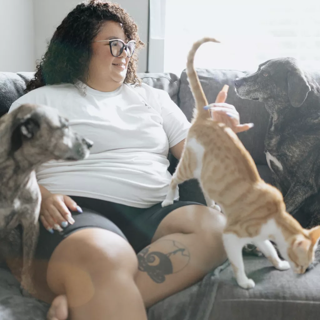 A lady with two pets.